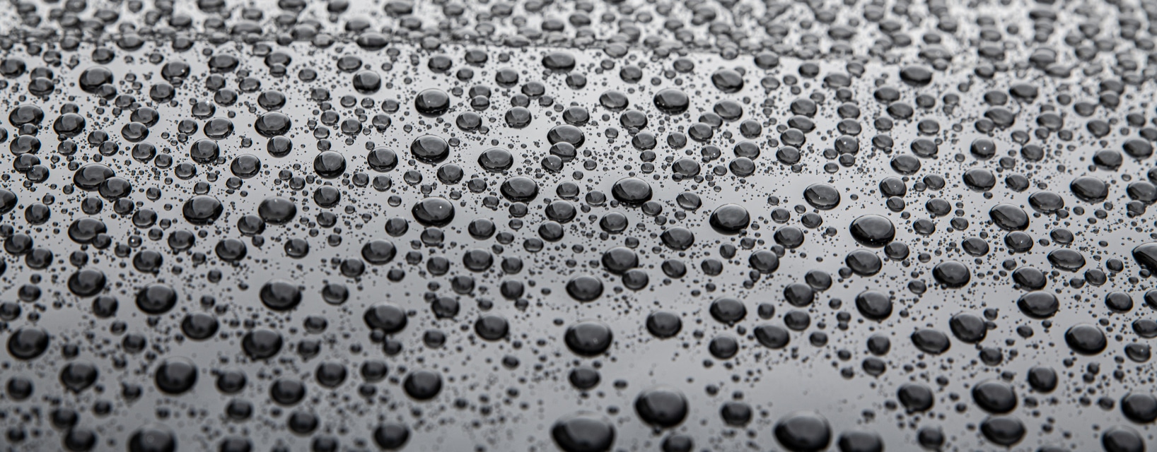 Water drops on car paint. Hydrophobic water effect on car body